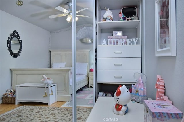 bedroom with light wood-type flooring and ceiling fan