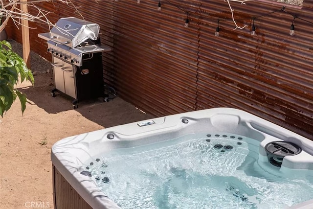 exterior space featuring a jacuzzi