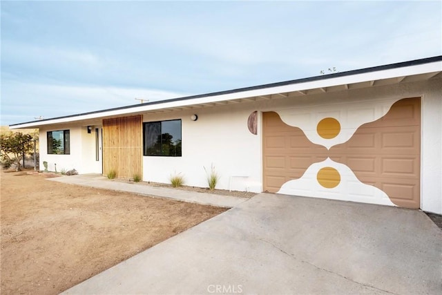 ranch-style home featuring a garage