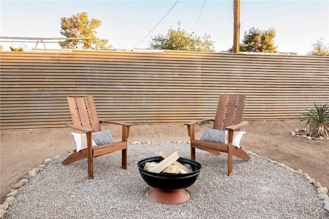 view of patio with a fire pit