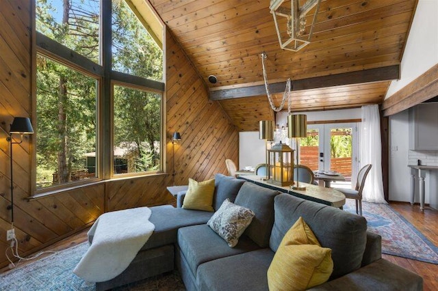 living room featuring high vaulted ceiling, wood ceiling, wood walls, and hardwood / wood-style floors