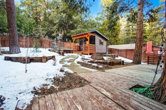 view of snow covered deck