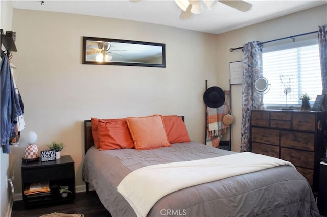 bedroom featuring ceiling fan and hardwood / wood-style flooring