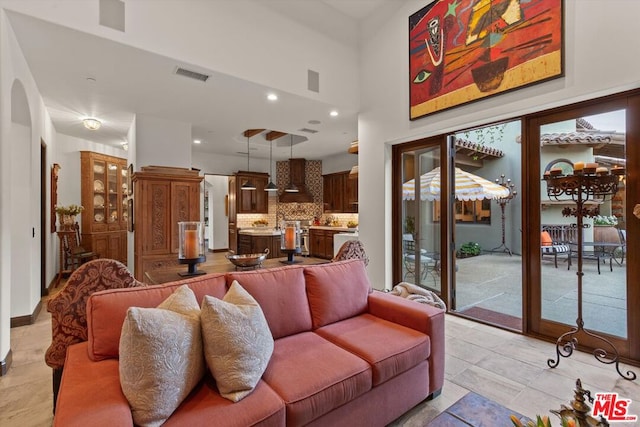 living room with a towering ceiling