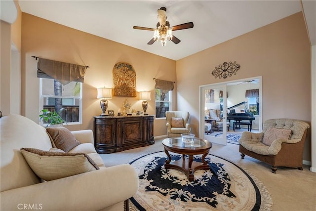 living room featuring ceiling fan and light colored carpet