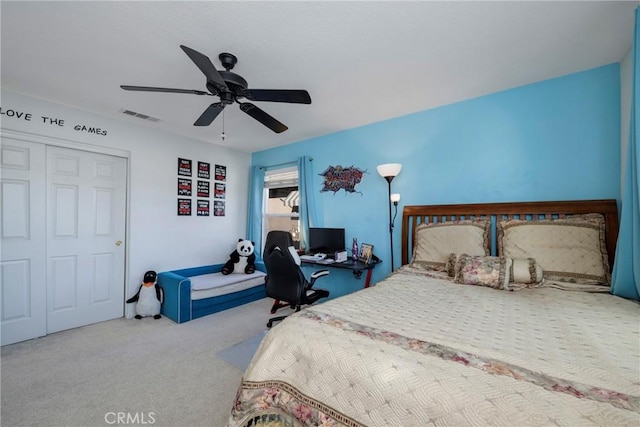 bedroom with ceiling fan, a closet, and carpet floors