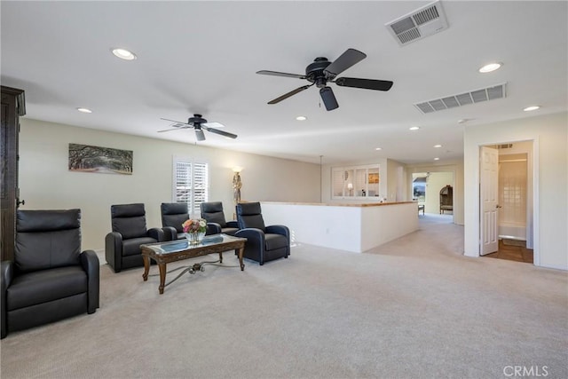 living room featuring ceiling fan and light colored carpet