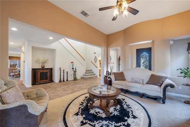 tiled living room featuring ceiling fan