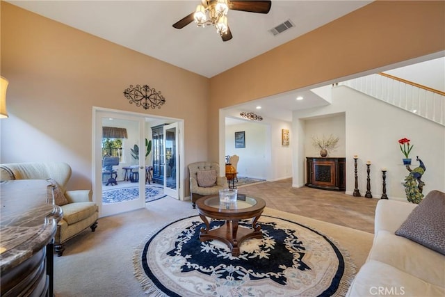 living room with ceiling fan and french doors