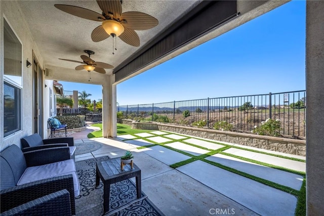 view of patio featuring ceiling fan