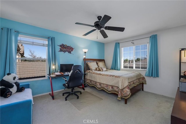 carpeted bedroom featuring ceiling fan