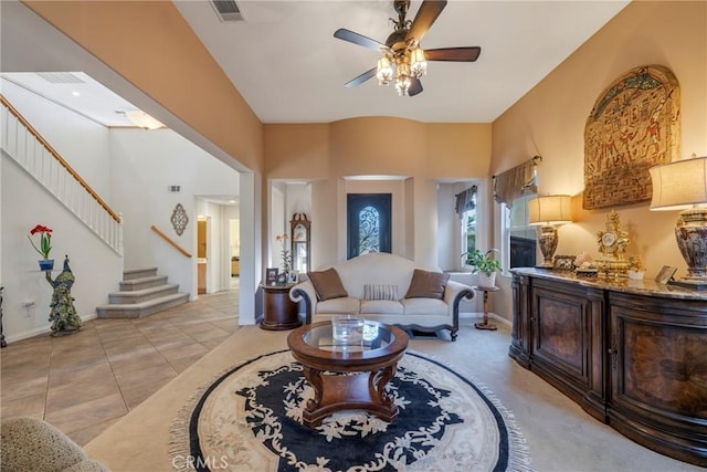 tiled living room with ceiling fan