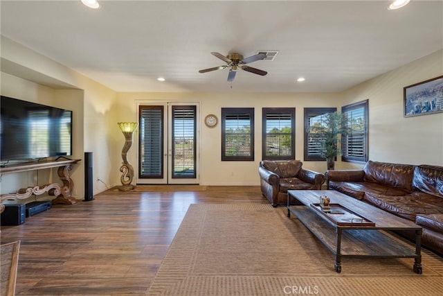 living room with ceiling fan, a healthy amount of sunlight, and wood-type flooring