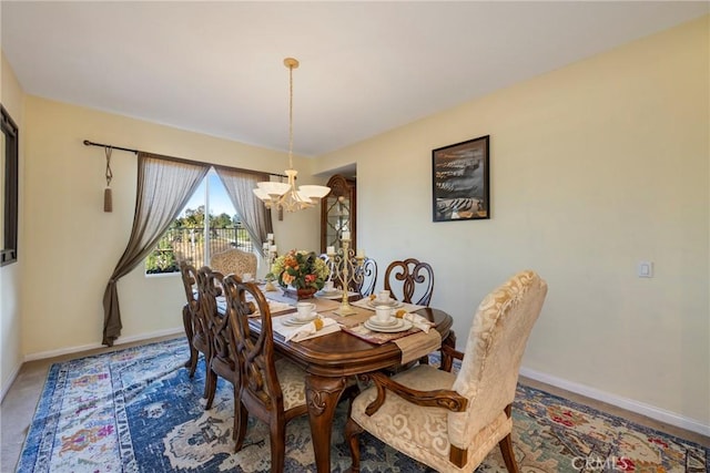 dining area featuring an inviting chandelier