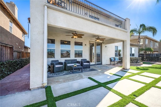 view of patio / terrace featuring ceiling fan, an outdoor living space, and a balcony