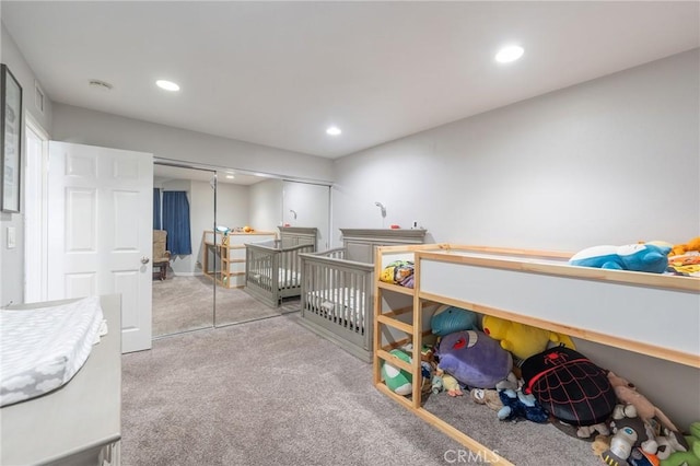 carpeted bedroom featuring a closet