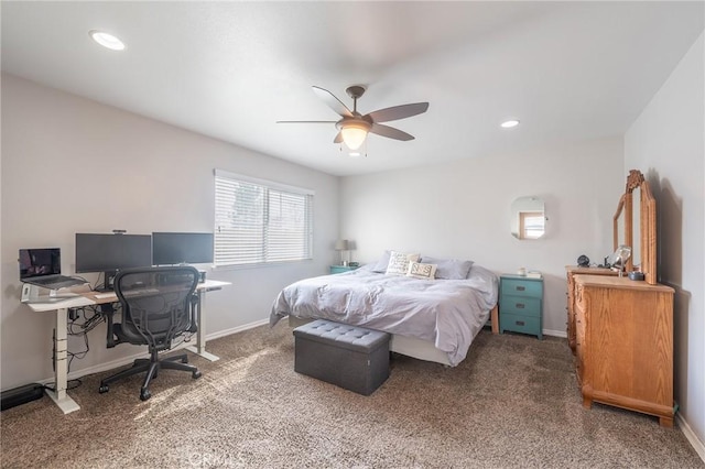 bedroom with ceiling fan and dark carpet