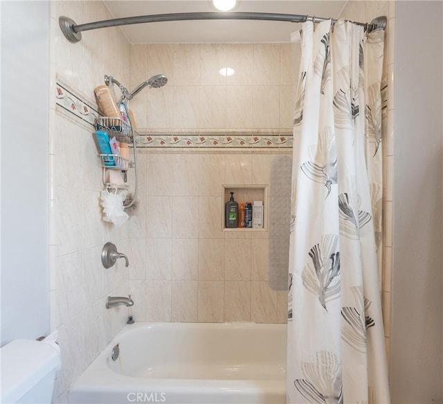 bathroom with shower / bath combo