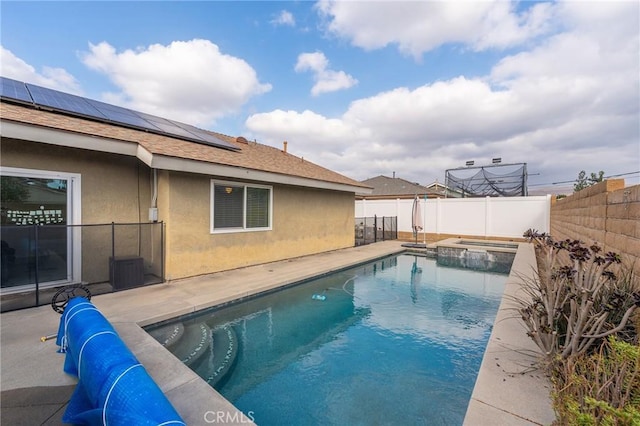 view of pool featuring an in ground hot tub and a patio