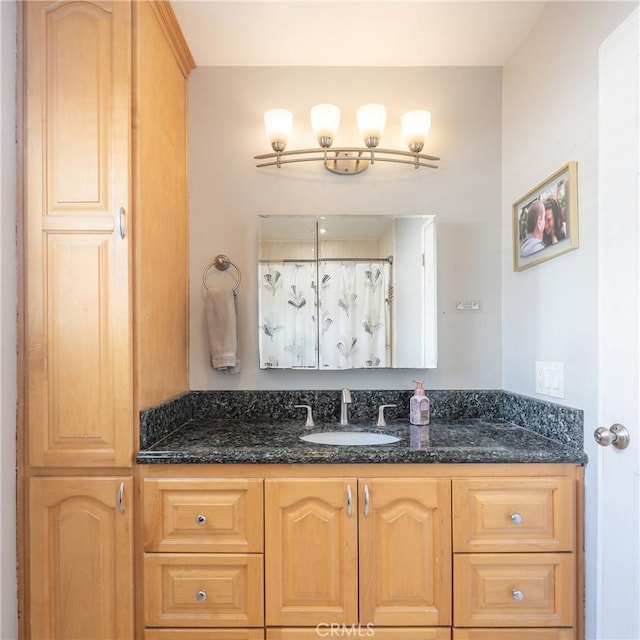 bathroom with vanity and a shower with shower curtain