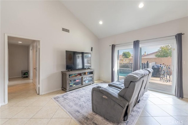 tiled living room with high vaulted ceiling