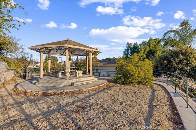 view of property's community with a patio area and a gazebo