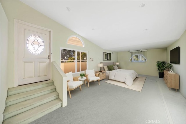 bedroom featuring carpet floors and vaulted ceiling