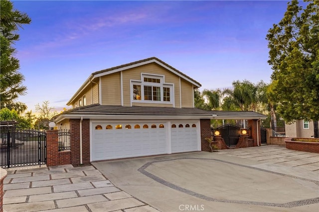 front facade featuring a garage and a carport