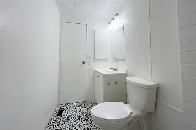 bathroom with toilet and vanity