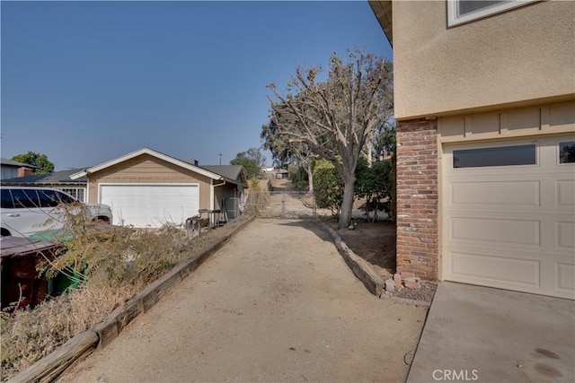 view of side of home featuring a garage