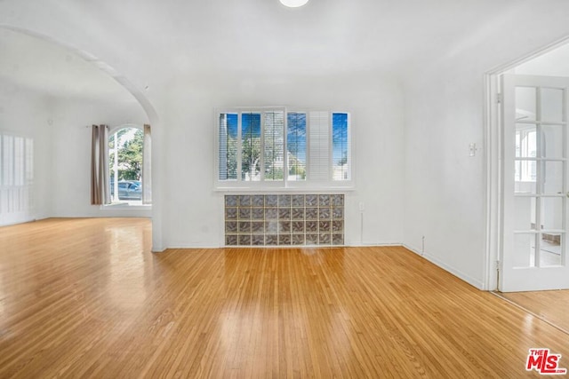 unfurnished living room featuring light hardwood / wood-style floors