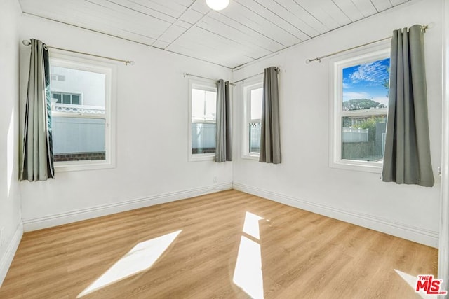 unfurnished room featuring light hardwood / wood-style floors