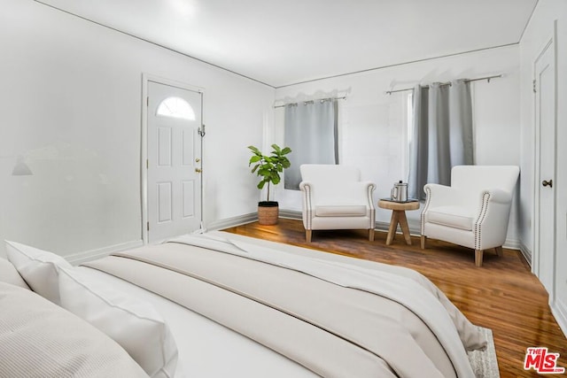 bedroom with wood-type flooring