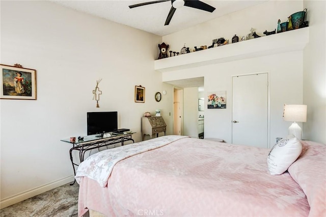 bedroom featuring baseboards, a towering ceiling, carpet, and a ceiling fan