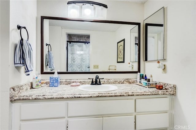 full bath with vanity and a shower with curtain