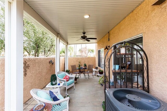 view of patio / terrace with a ceiling fan and central AC