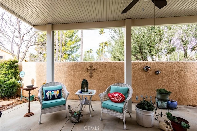 view of patio featuring ceiling fan