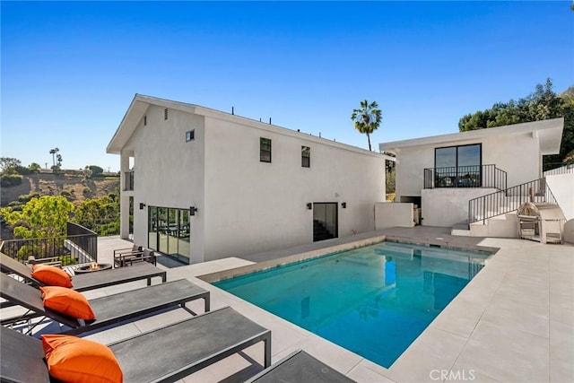 view of pool featuring a patio area