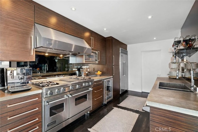 kitchen featuring exhaust hood, sink, dark wood-type flooring, stainless steel appliances, and wine cooler