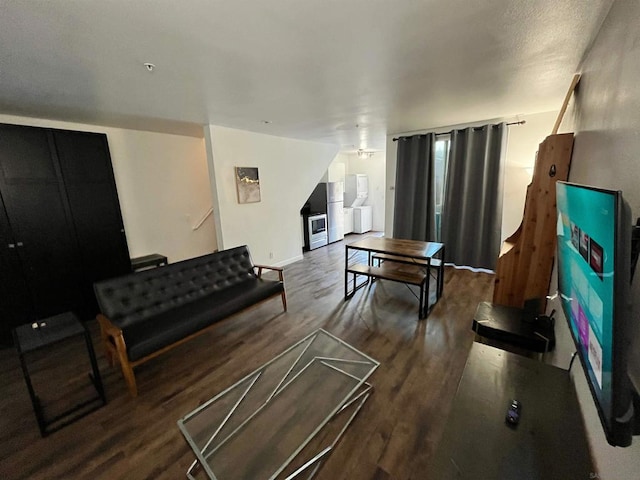 living room featuring ceiling fan and hardwood / wood-style floors