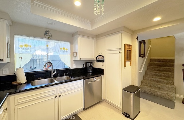 kitchen with white cabinetry, dishwasher, a raised ceiling, and sink