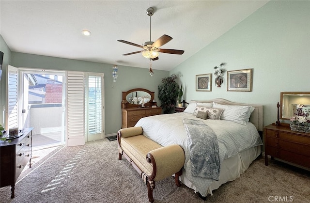 carpeted bedroom with ceiling fan, access to exterior, and vaulted ceiling