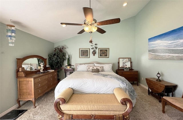 carpeted bedroom with ceiling fan and vaulted ceiling