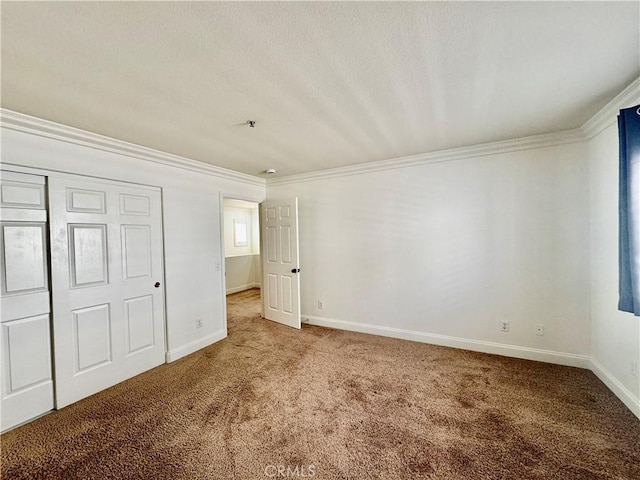 unfurnished bedroom featuring a closet, carpet flooring, and ornamental molding