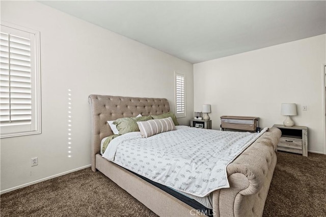 bedroom featuring dark colored carpet