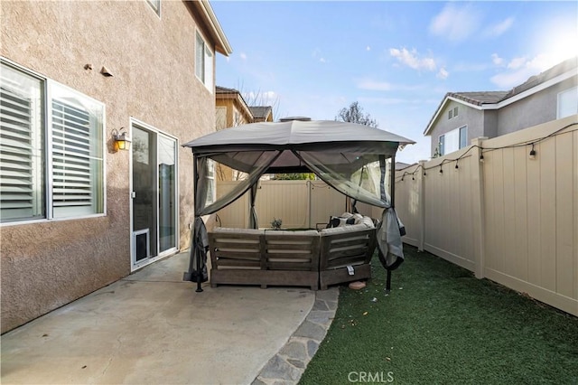 view of patio featuring an outdoor living space and a gazebo