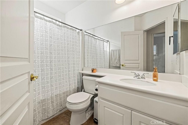 bathroom featuring vanity, walk in shower, tile patterned floors, and toilet