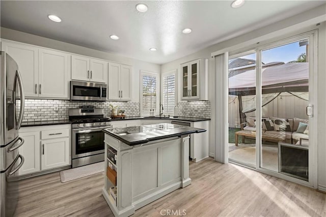 kitchen featuring white cabinetry, appliances with stainless steel finishes, and sink