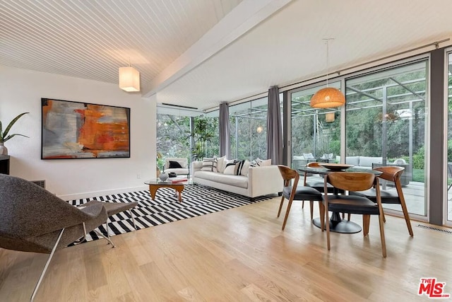 sunroom with beamed ceiling