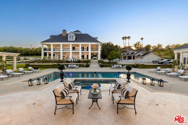 view of pool featuring a patio